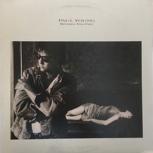 Paul Young : Between Two Fires (LP, Album, Pit)