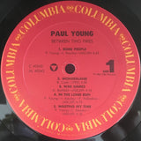 Paul Young : Between Two Fires (LP, Album, Pit)