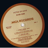 Elton John : Victim Of Love (LP, Album, Tan)